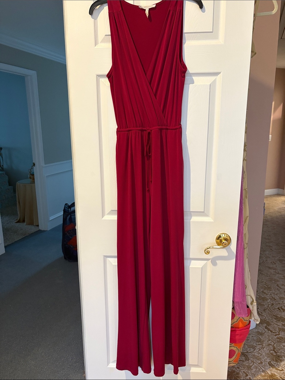 BCBGeneration Sleeveless Wine-Red Wide-Leg Jumpsuit with Tie Waist